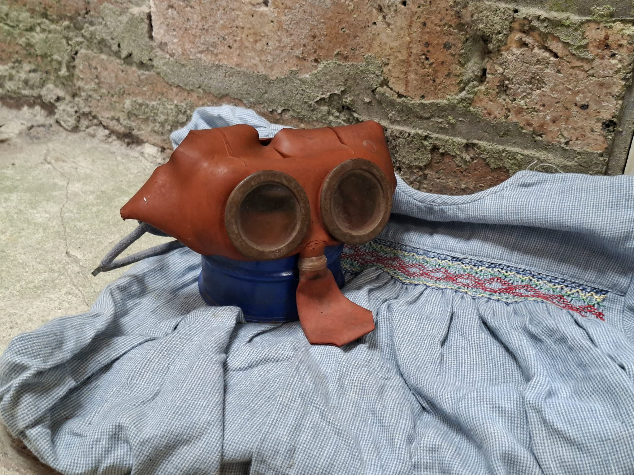 Childs gas mask on a homemade WW2 childs dress.